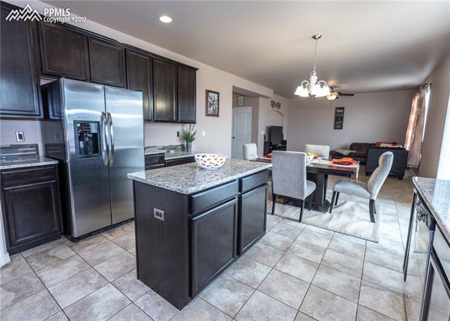 2105 Reed Grass Way Colorado Springs, CO 80915 - Photo 23 of 23 A chef and entertainers dream! Open concept floor plan allows you to cook and entertain with family & friends.