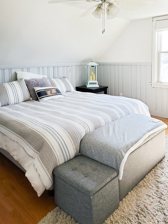 16 Griffin Road Peabody, MA 01960 - Photo 15 of 26 a bedroom with a bed and a chandelier