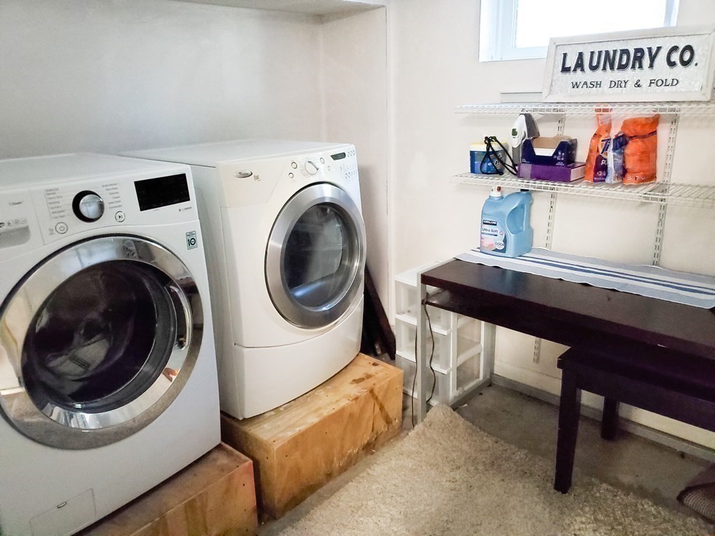 16 Griffin Road Peabody, MA 01960 - Photo 18 of 26 a living room with furniture and a dining table