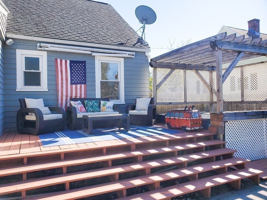 16 Griffin Road Peabody, MA 01960 - Photo 20 of 26 a living room with furniture and a fireplace