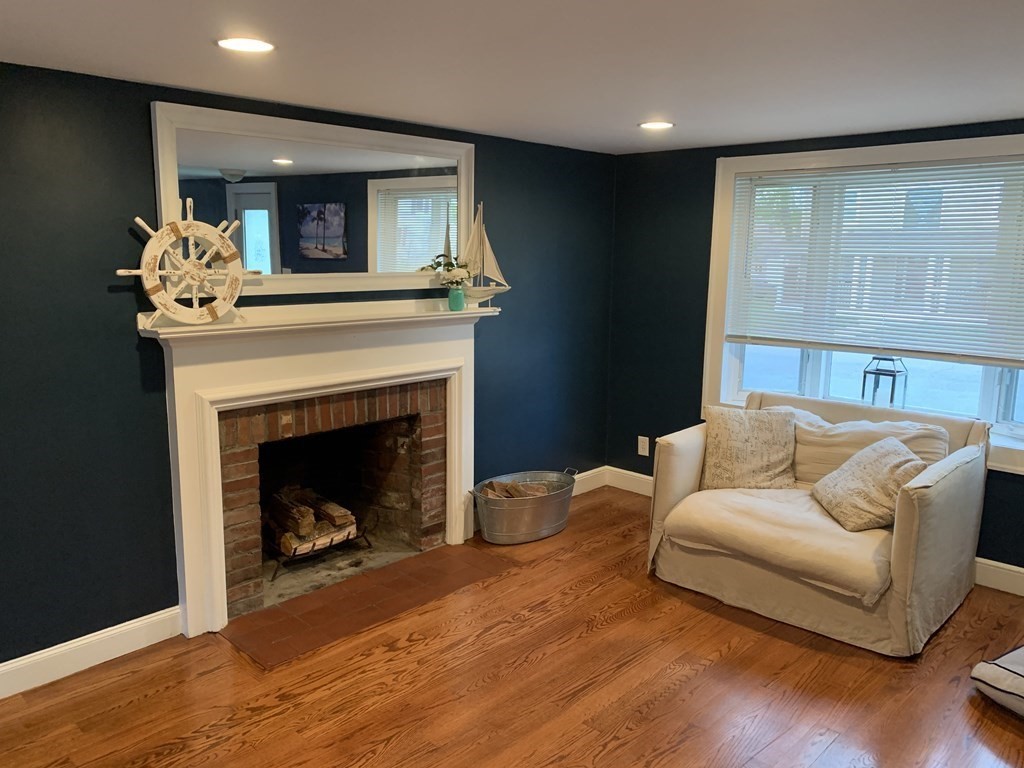 16 Griffin Road Peabody, MA 01960 - Photo 5 of 26 a living room with furniture and a fireplace