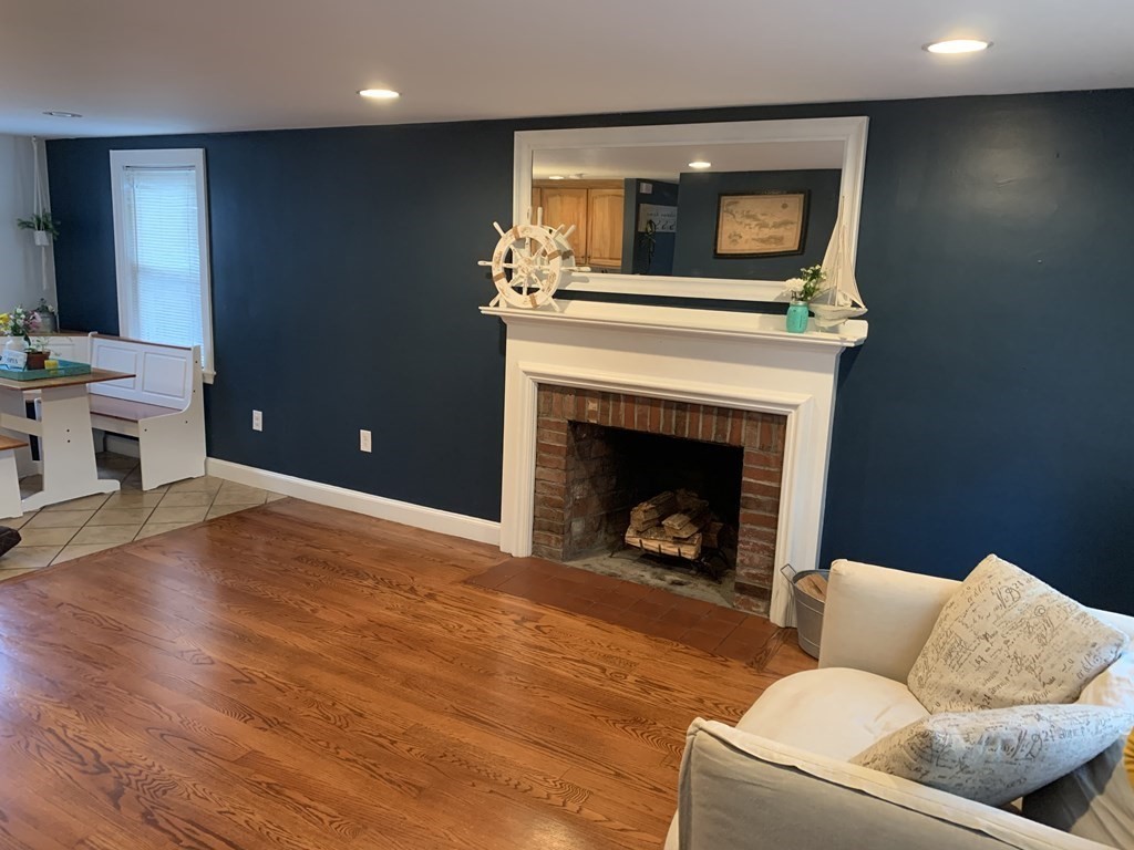 16 Griffin Road Peabody, MA 01960 - Photo 6 of 26 a living room with furniture and a fireplace