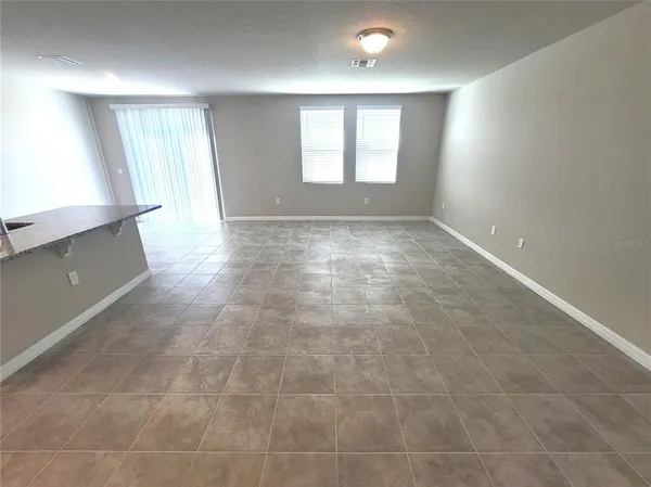 a large kitchen with cabinets and stainless steel appliances