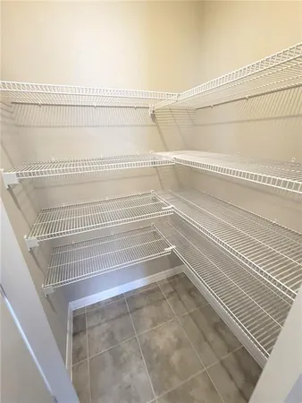 a kitchen with kitchen island granite countertop a sink and a stove