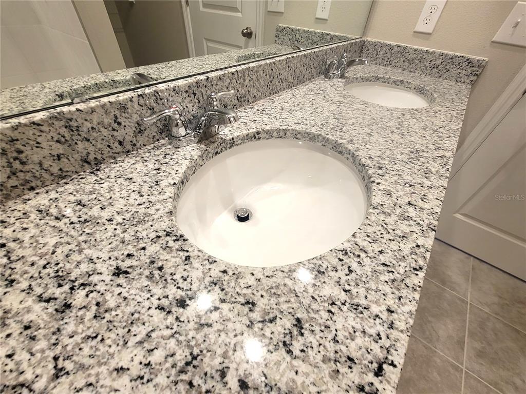 1618 Bark Rdg Drive Auburndale, FL 33823 - Photo 29 of 40 a bathroom with a sink and a mirror