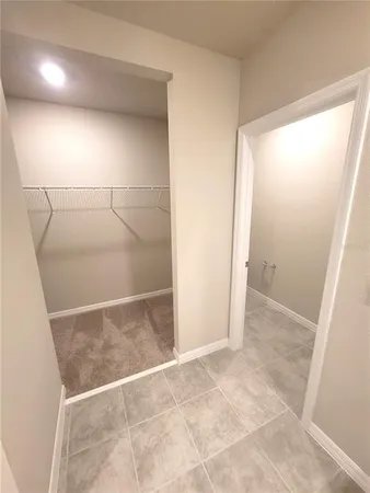 a bathroom with a glass shower door