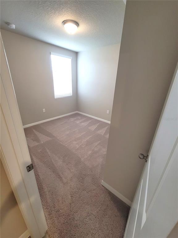 1618 Bark Rdg Drive Auburndale, FL 33823 - Photo 10 of 40 an empty room with windows and closet