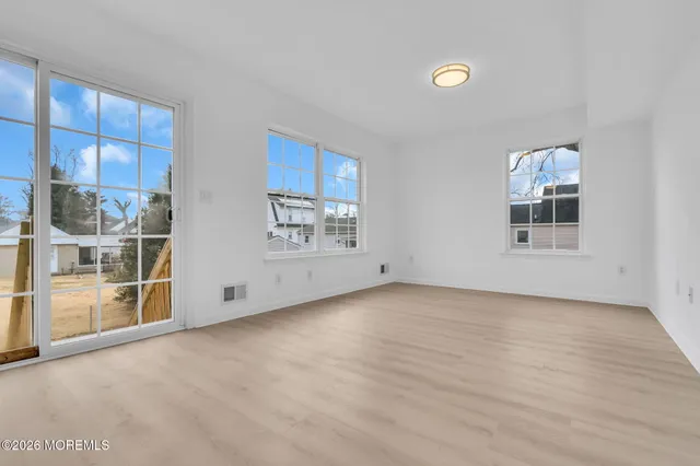 a view of kitchen with wooden floor