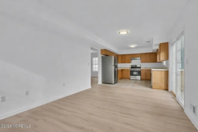 a kitchen with a sink and a refrigerator