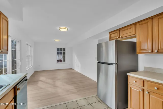 a kitchen with a stove a sink and cabinets