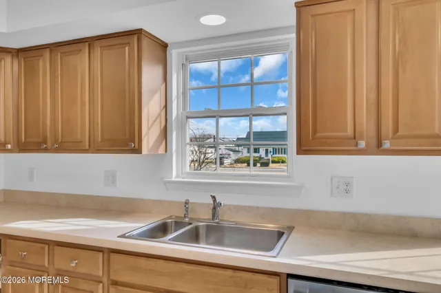 a view of walk in closet with mirror