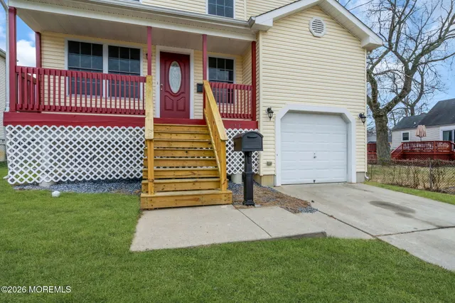 a view of balcony with wooden floor and fence