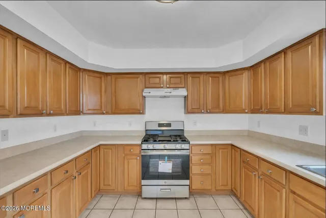 a bathroom with a granite countertop sink and a vanity