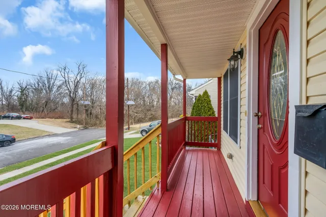 a balcony with wooden floor