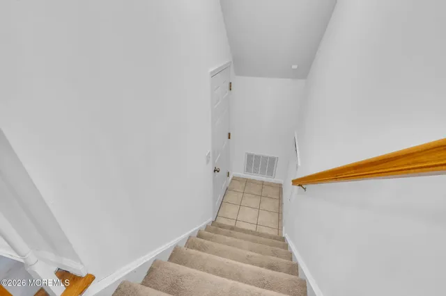 a view of a house with a yard and garage