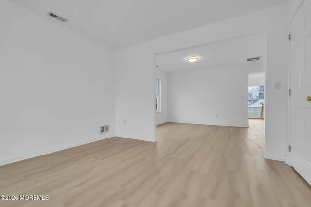 a view of a livingroom with wooden floor