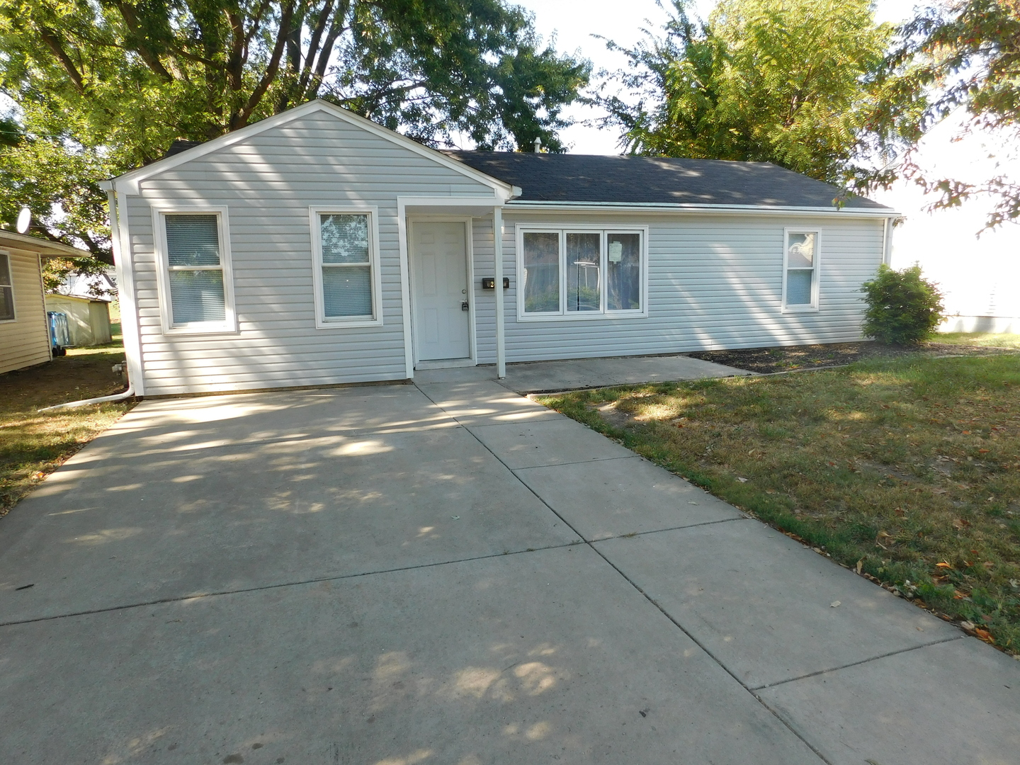a view of a yard in front of a house with garage