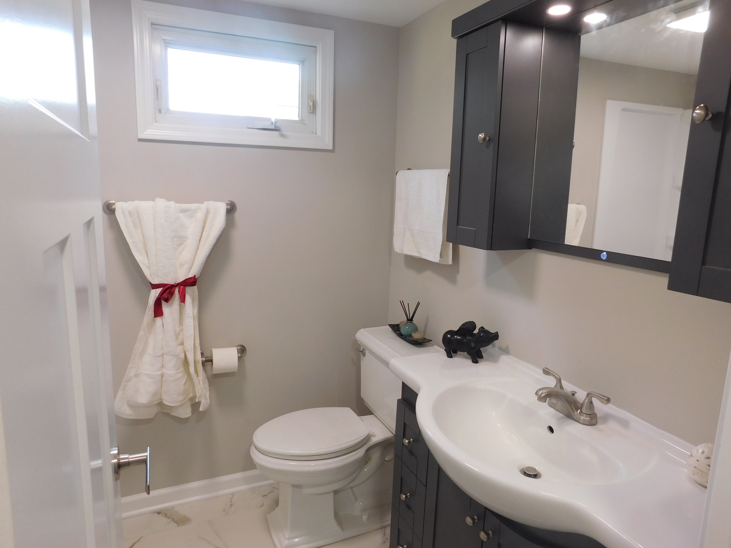 271 Toni Street Bourbonnais, IL 60914 - Photo 11 of 24 a bathroom with a sink toilet and mirror