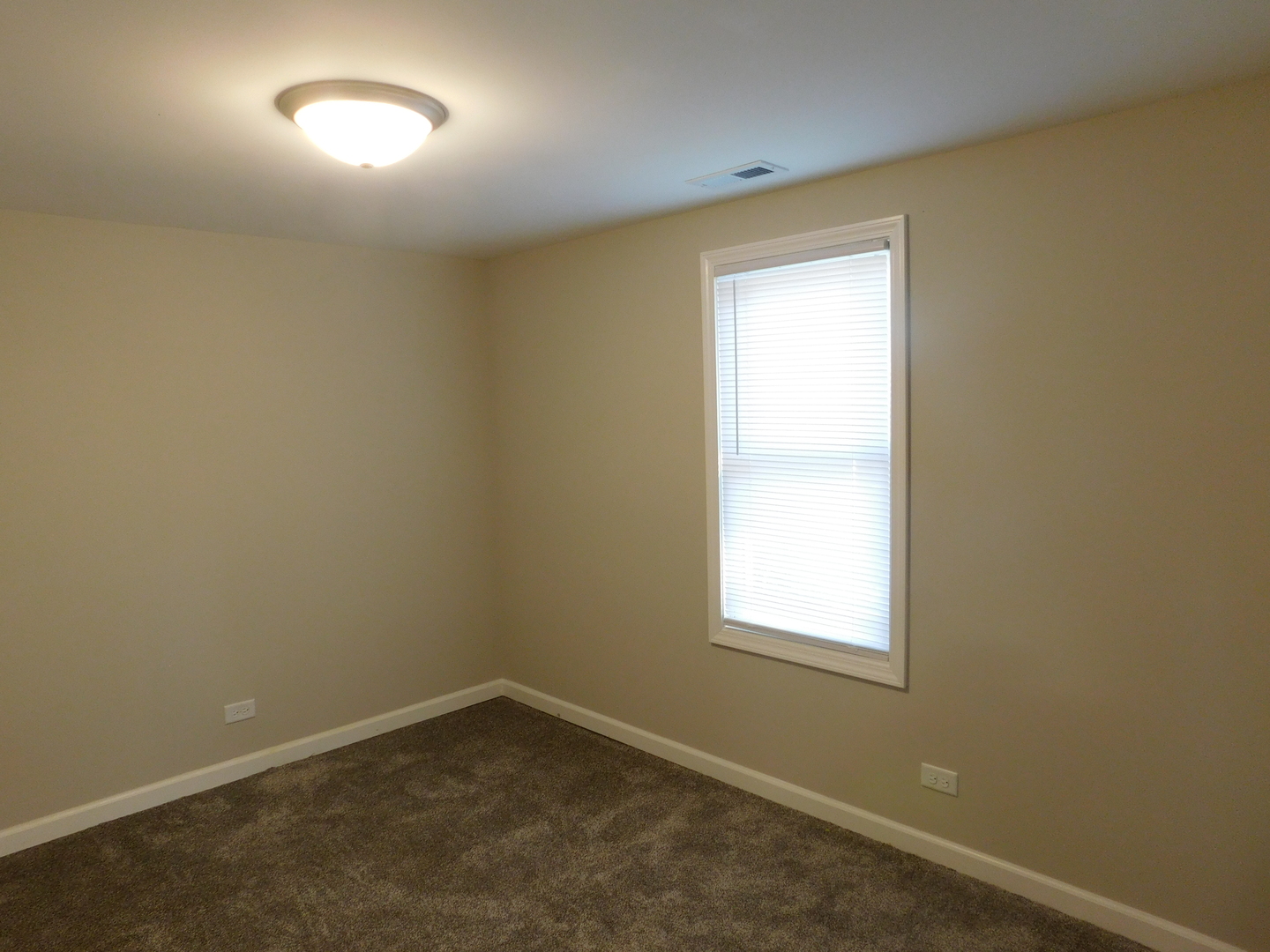 271 Toni Street Bourbonnais, IL 60914 - Photo 22 of 24 an empty room with a window