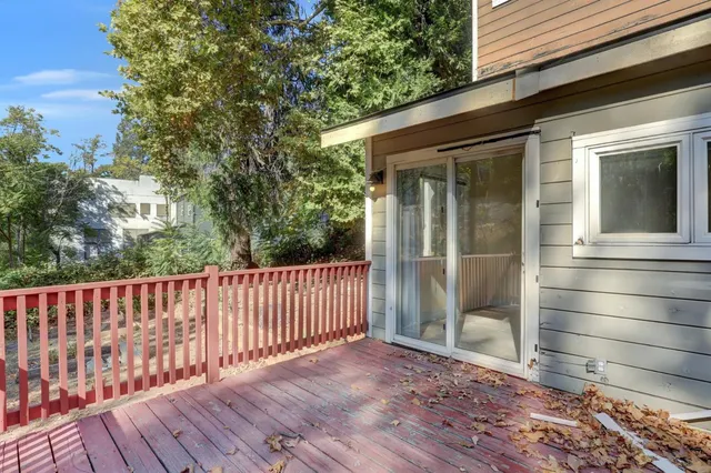 a kitchen with a refrigerator sink and cabinets