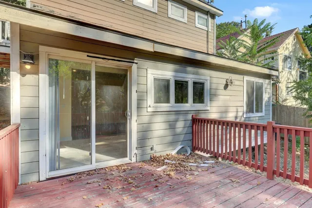a large kitchen with a refrigerator and a sink