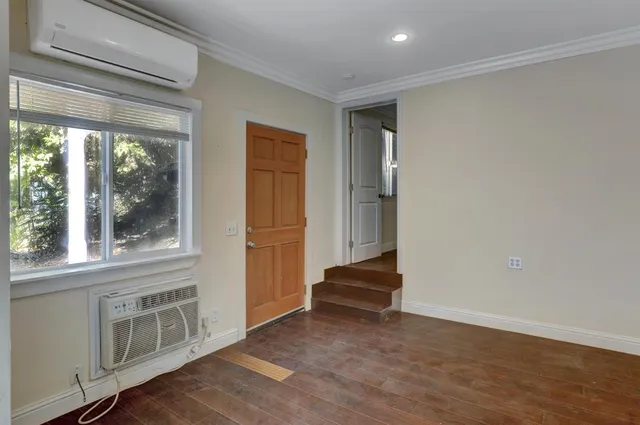 a stove top oven sitting inside of a kitchen