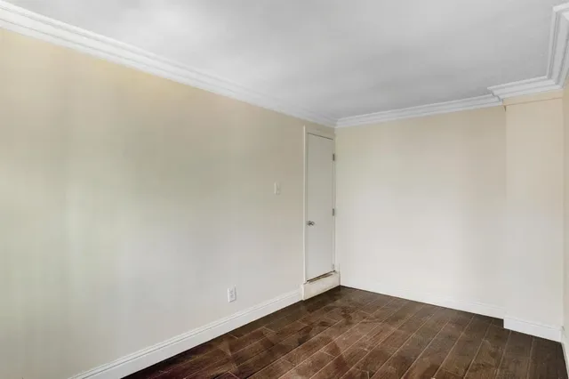 a view of a wooden fence and trees