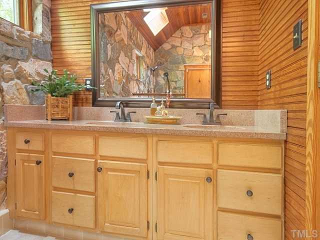 7422 Johnson Mill Road Bahama, NC 27503 - Photo 11 of 25 a bathroom with a sink and a mirror