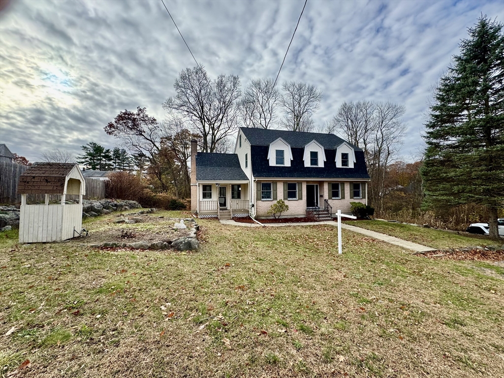 24 Cole Terrace Randolph, MA 02368 - Photo 2 of 40 a front view of a house with a yard