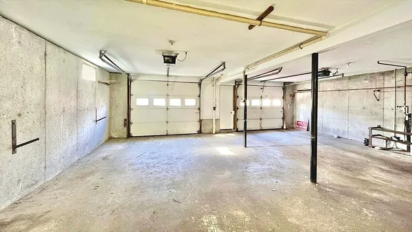 a view of a livingroom with furniture and a window
