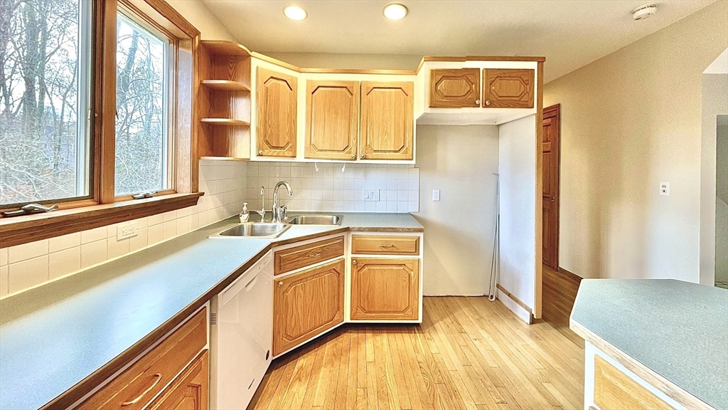 24 Cole Terrace Randolph, MA 02368 - Photo 6 of 40 a kitchen with a sink appliances and cabinets