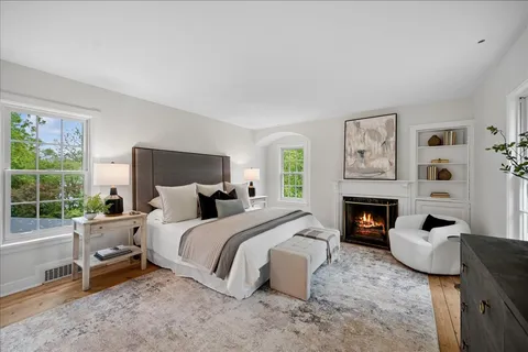 a bed room with a bed and a fireplace
