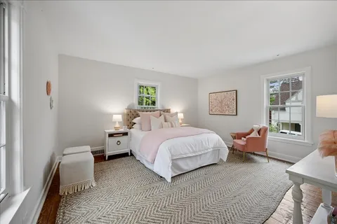 a bedroom with a bed and a couch