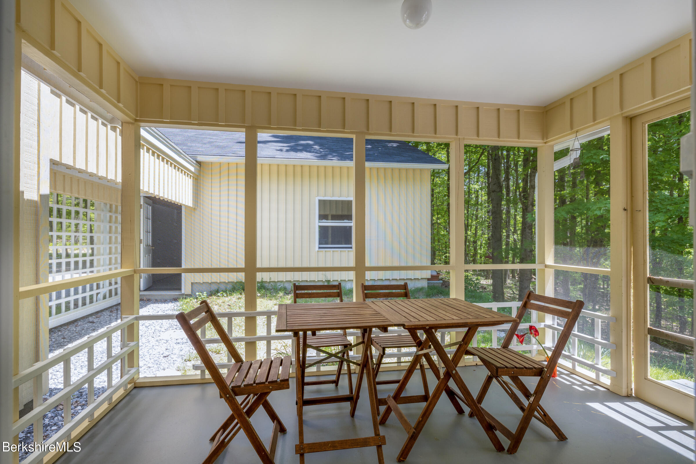 255 Hupi Road Monterey, MA 01245 - Photo 11 of 26 a view of a dining room with furniture window and outside view