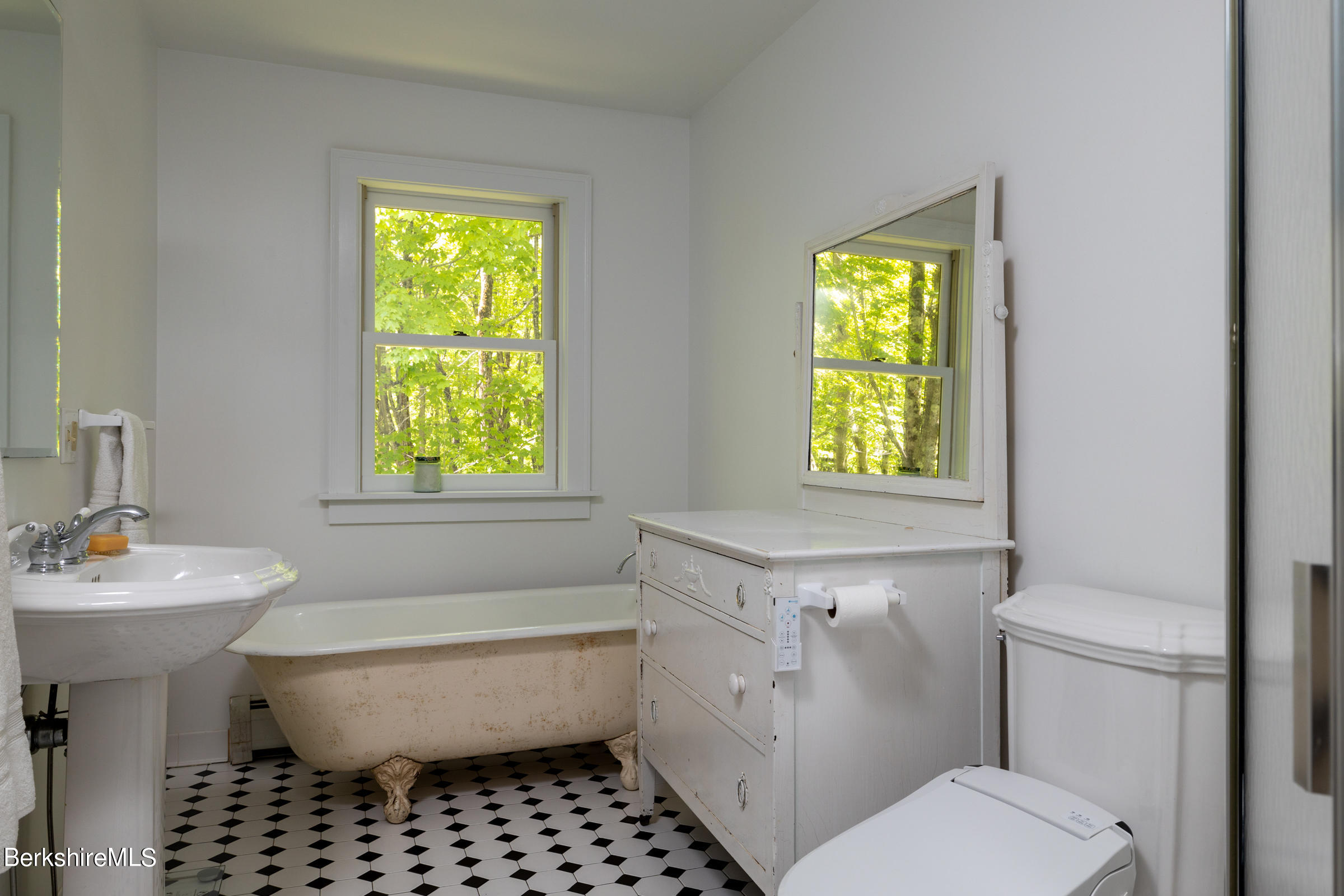 255 Hupi Road Monterey, MA 01245 - Photo 18 of 26 a bathroom with a toilet a sink and a window
