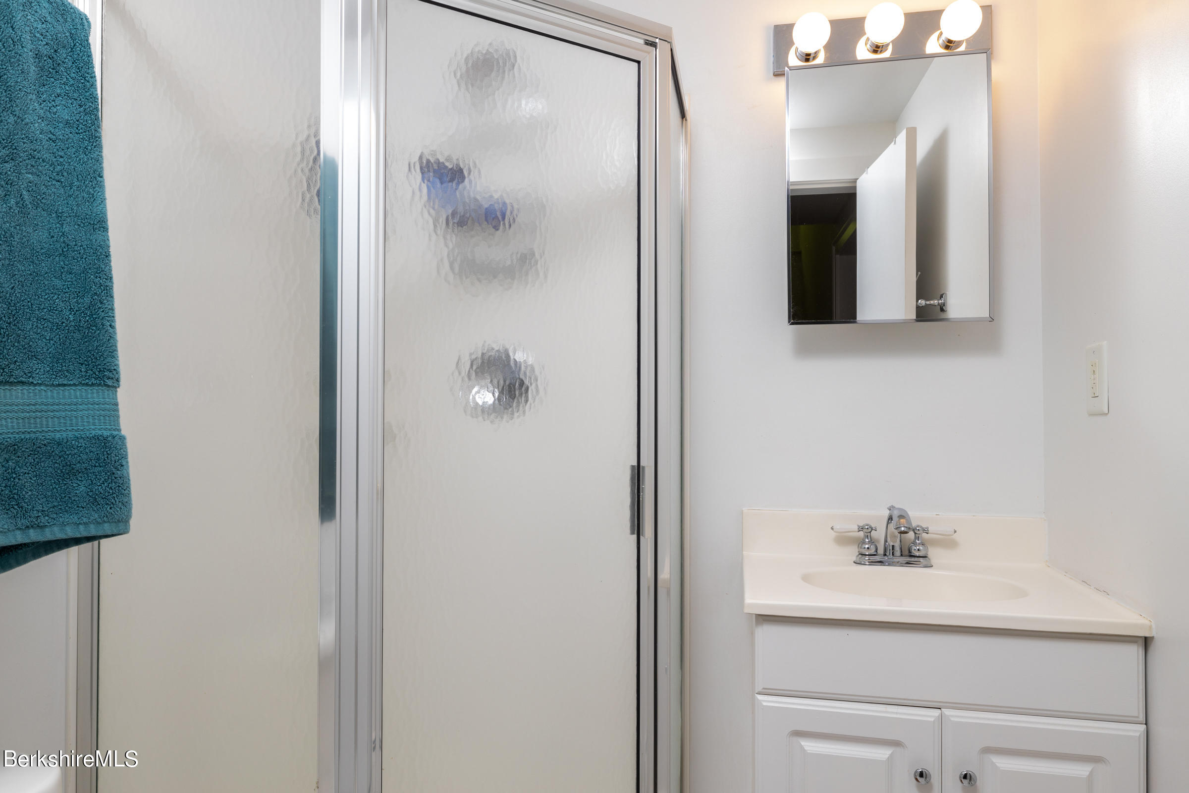 255 Hupi Road Monterey, MA 01245 - Photo 20 of 26 a bathroom with a bathtub and mirror