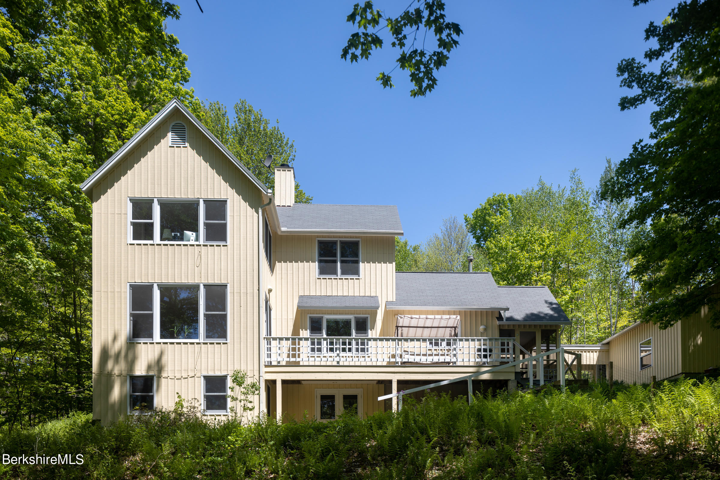 255 Hupi Road Monterey, MA 01245 - Photo 3 of 26 an aerial view of a house with a yard and potted plants