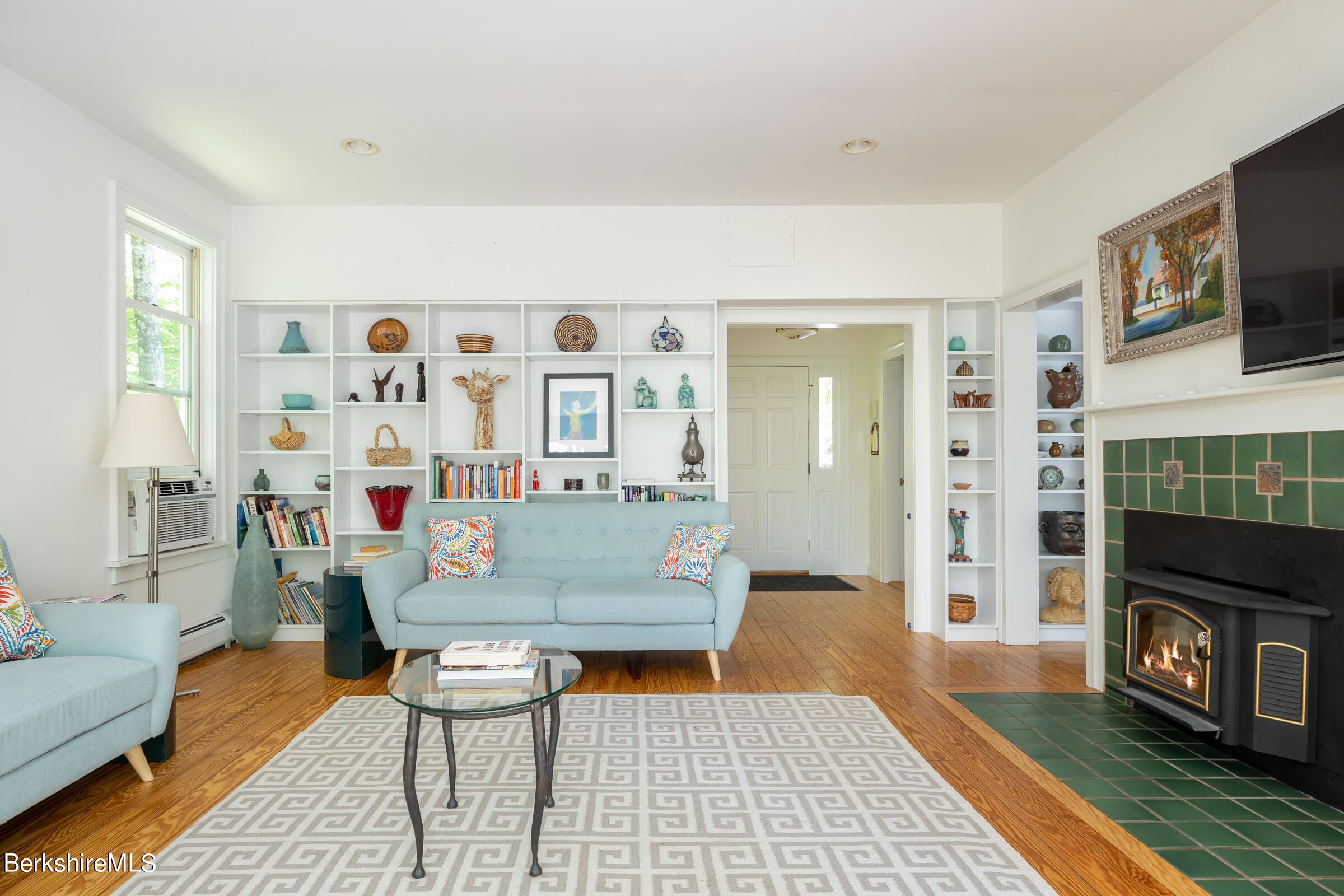 255 Hupi Road Monterey, MA 01245 - Photo 4 of 26 a living room with furniture and a fireplace