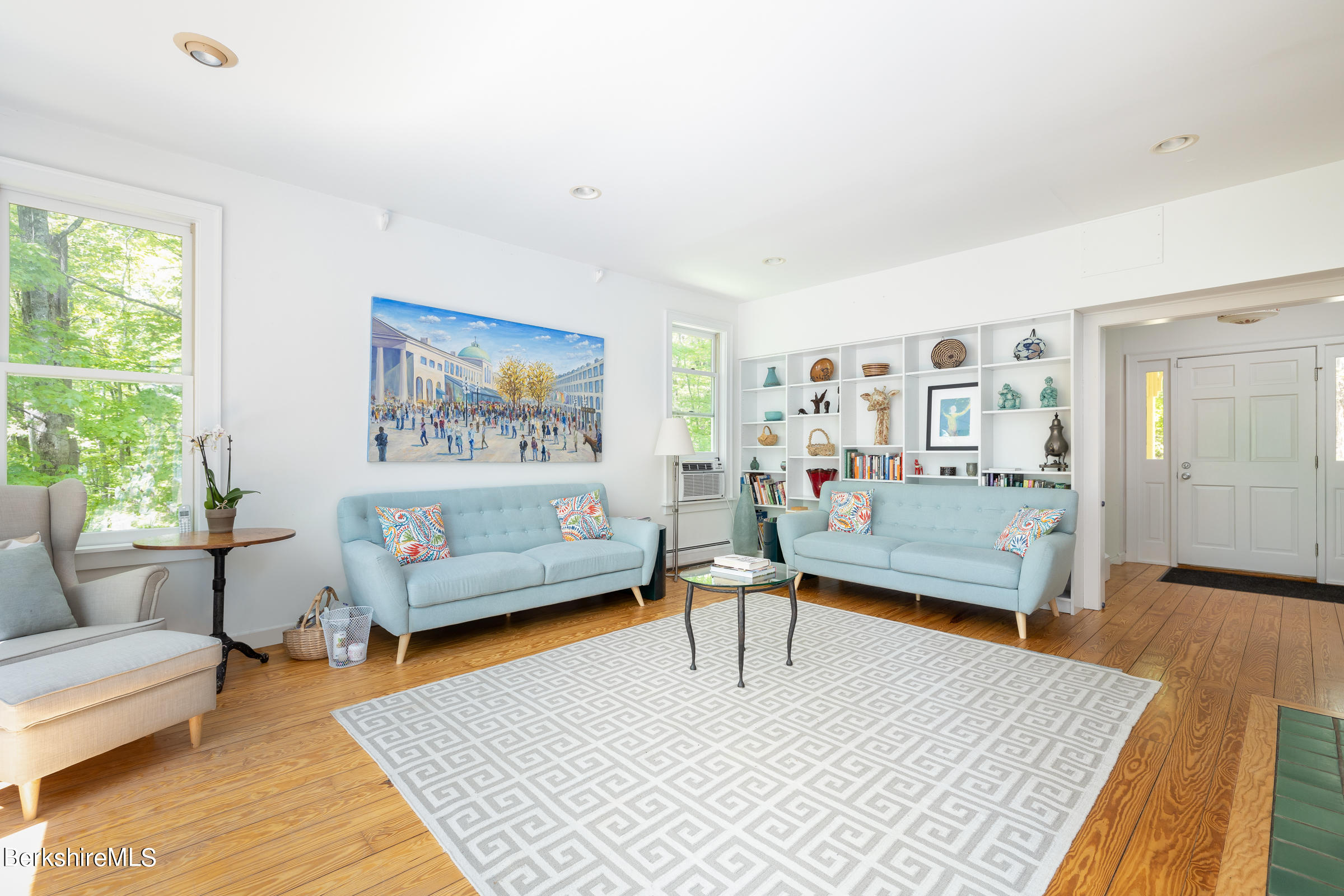 255 Hupi Road Monterey, MA 01245 - Photo 5 of 26 a living room with furniture and a table