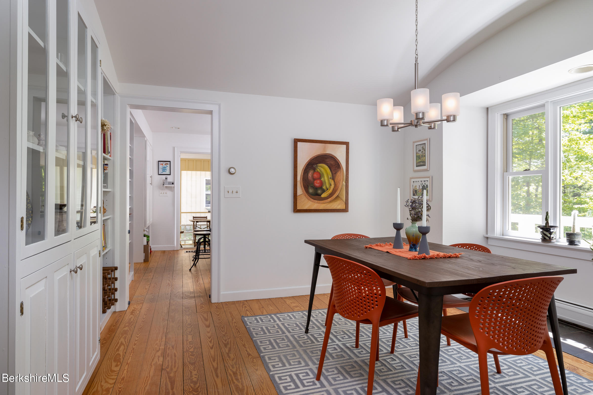 255 Hupi Road Monterey, MA 01245 - Photo 8 of 26 a view of a dining room with furniture window and wooden floor
