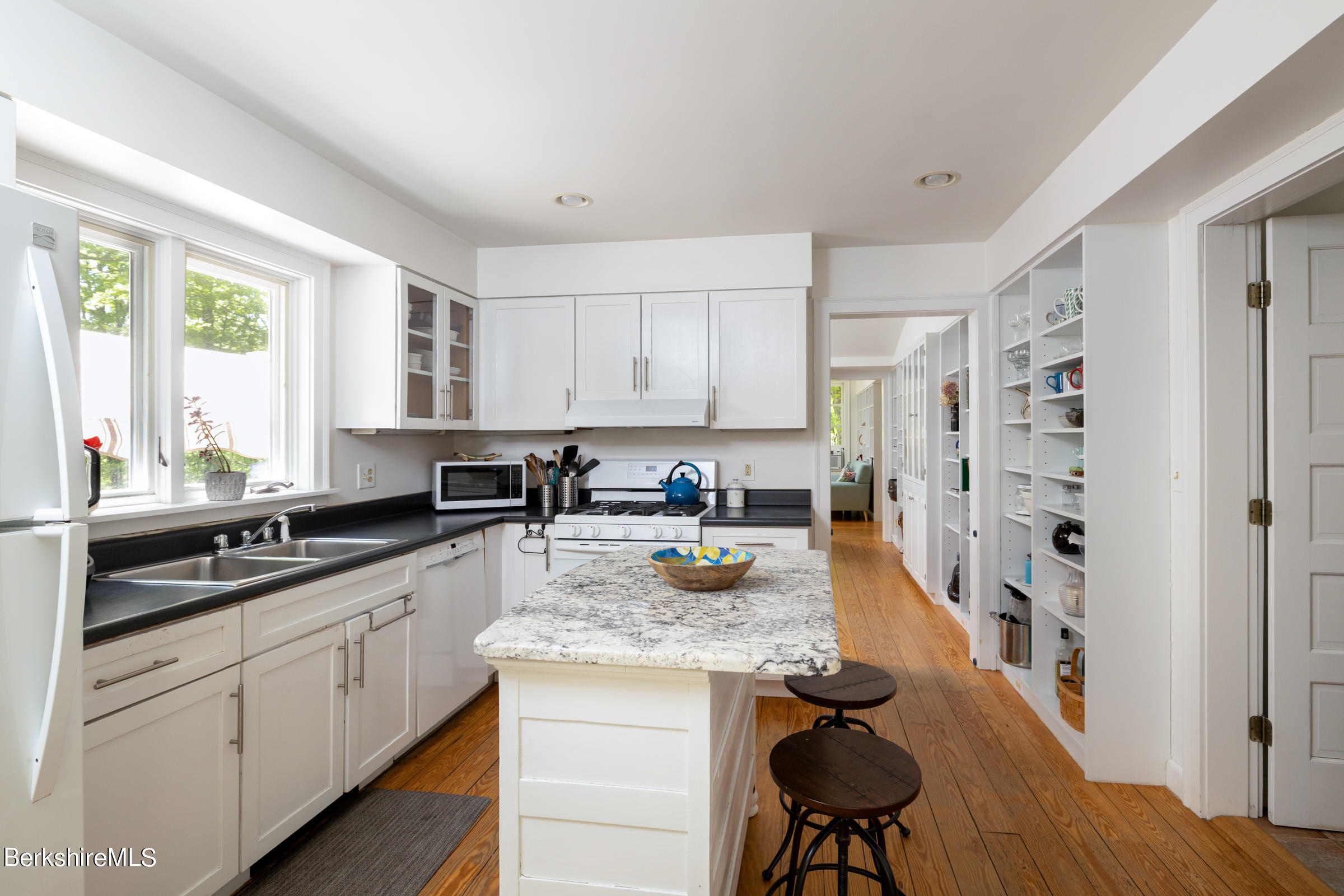 255 Hupi Road Monterey, MA 01245 - Photo 9 of 26 a kitchen with stainless steel appliances granite countertop a lot of counter space and wooden floor