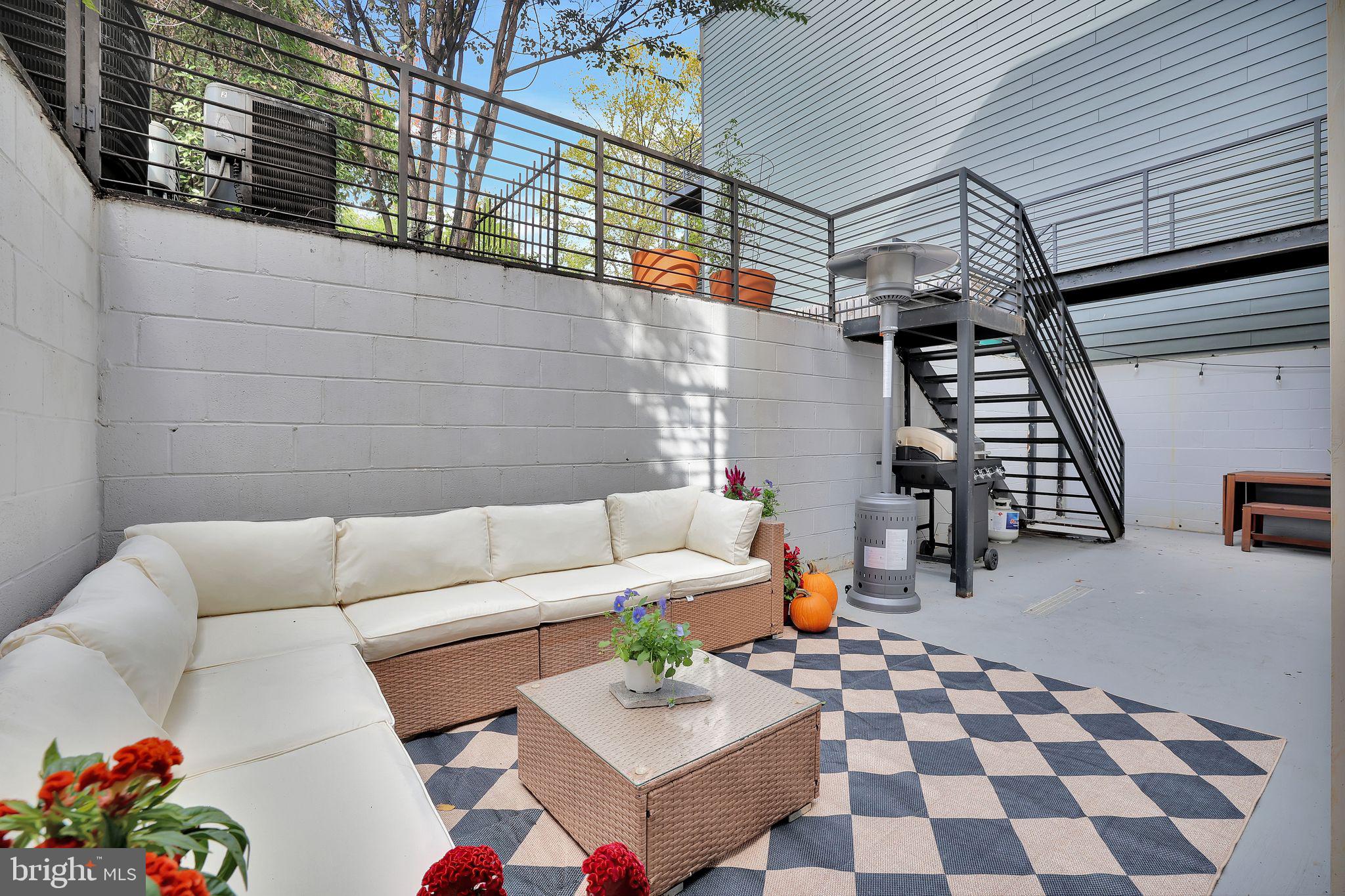 a living room with furniture and a rug