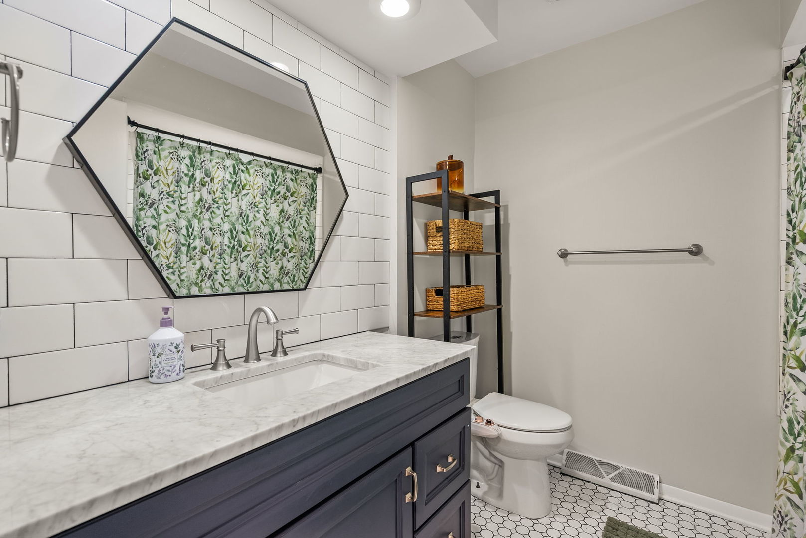 1435 26th Avenue Moline, IL 61265 - Photo 17 of 38 a bathroom with a granite countertop sink a toilet and a shower