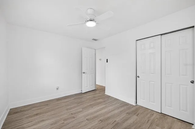a bathroom with a sink toilet vanity and tub