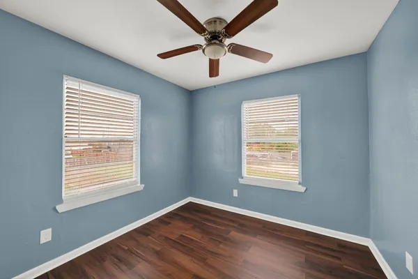 a bedroom with bed and a window