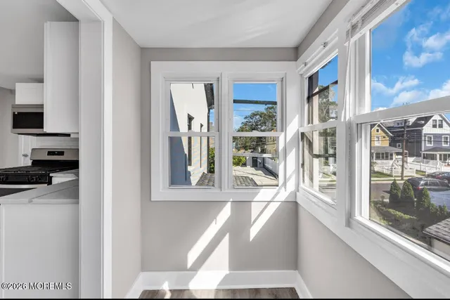 a view of a living room with a large window