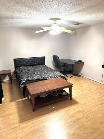 a bedroom with bed and window