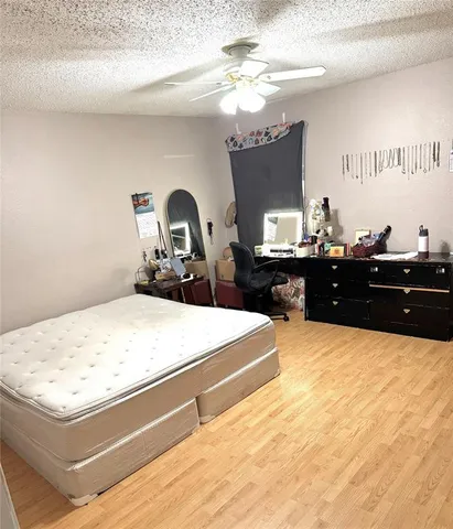 a living room with hard wood flooring
