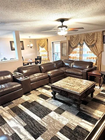 a living room with furniture and a rug