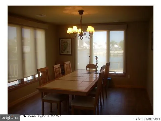 a view of a dining room with furniture and window